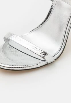 MICHAEL Michael Kors Asha - Sandalen Met Hoge Hak - Silver -Farfetch Winkel 1d058d5e899a48fd90d8170c02d79679