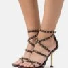 MICHAEL Michael Kors Imani Strappy- Sandalen - Chocolate -Farfetch Winkel 7e4716181a8b40b38ca8626cfa5a2956