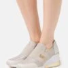 MICHAEL Michael Kors Felix Trainer Extreme - Sneakers Laag - Champagne -Farfetch Winkel 93bbebb3a625432791cddaa8f06fc943
