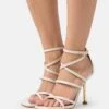 MICHAEL Michael Kors Imani Strappy - Sandalen - Light Cream -Farfetch Winkel b36a3ea73a214b23a74eb23a5e0e57b7