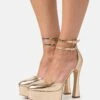 MICHAEL Michael Kors Martina Ankle Strap - Plateaupumps - Pale Gold -Farfetch Winkel c56187f28bea43f09e45d643de775ed1