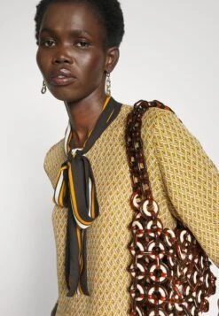 MICHAEL Michael Kors Lattice Logo Bow Blouse - Blouse - Marigold -Farfetch Winkel cb70d233532c4ebb968868932ae25786