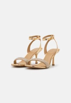 MICHAEL Michael Kors Carrie- Sandalen - Gold -Farfetch Winkel ceed7de748cd45a583fc9087aa62e89e